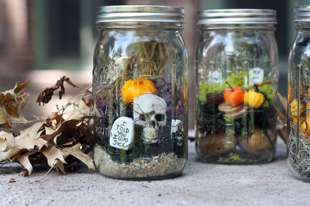 mason jars willed with autumn decorations