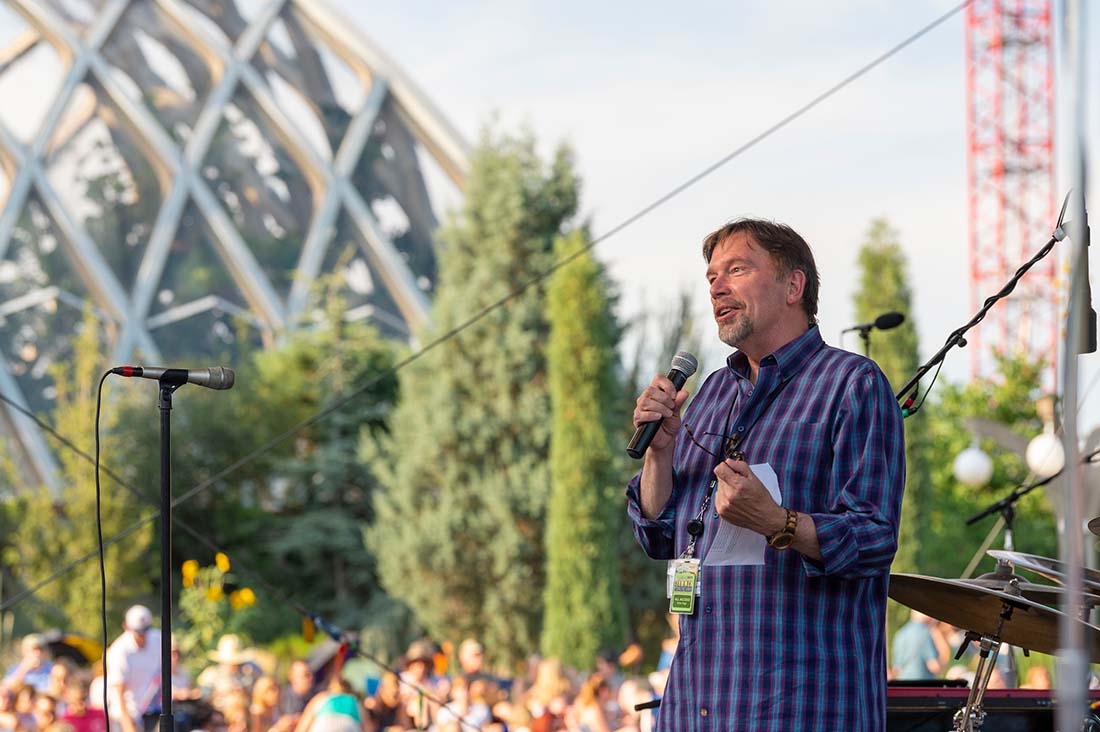 Brian giving introduction on stage before concert