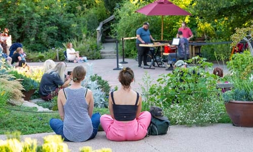 people watching live music in garden